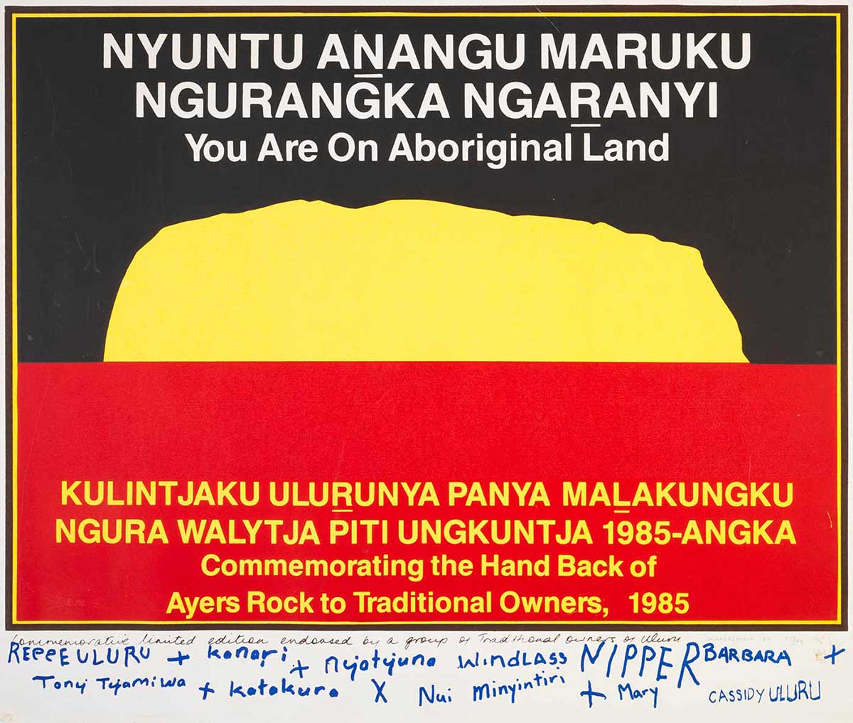 Poster plaque displaying the commeration of handing back to traditional owners in 1985