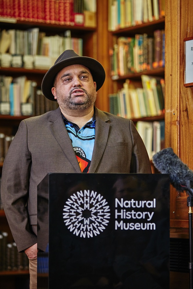 A man talks behind a podium
