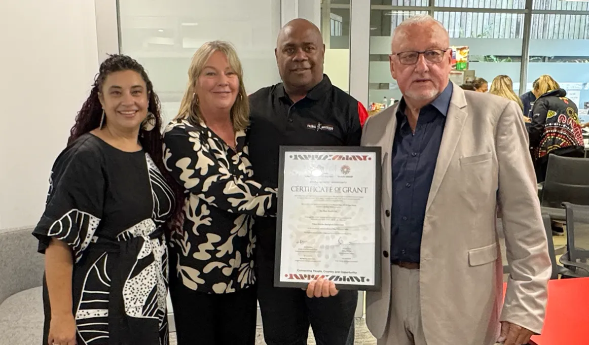 Four people accept an award
