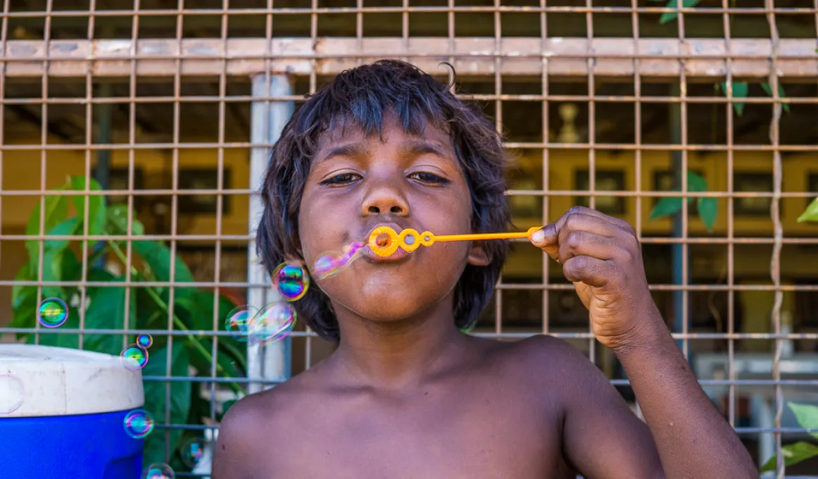 Child blowing bubbles