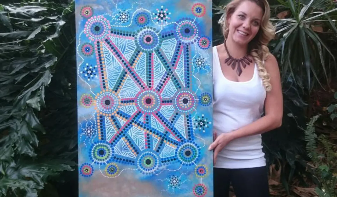 Lani Balzan with her artwork 'Songlines tie all Aboriginal people together'