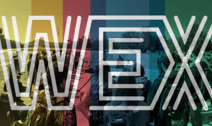 Many young people stand in semi-circle watching a ceremony. The image is overlayed with the colours yellow, red, blue and green and the word WEX with letters made from multiple white lines in parallel.
