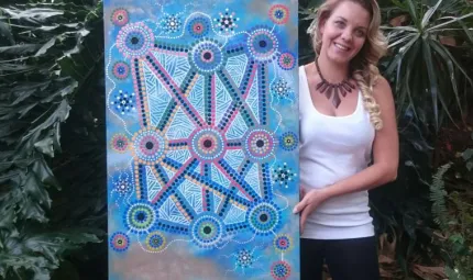 Lani Balzan with her artwork 'Songlines tie all Aboriginal people together'
