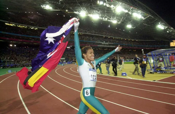 Cathy Freeman at the Sydney 2000 Olympics. Credit: AAP/Dean Lewins