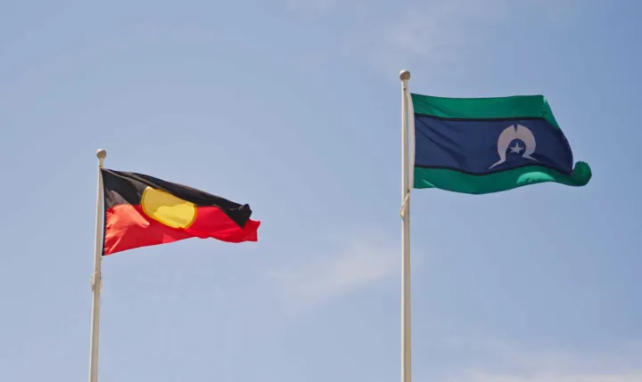 The Aboriginal Flag and the Torres Strait Islander Flag flying at the Australian War Memorial