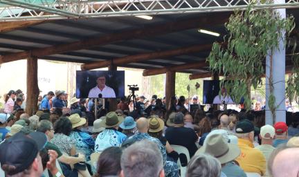 A crowd of people watching the Prime Minister deliver a speech at Garma Festival