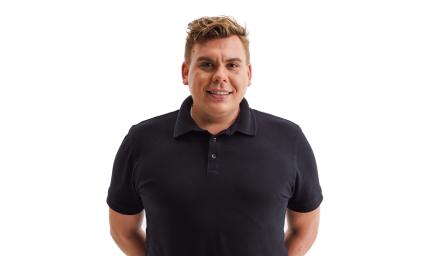 A man in a dark polo shirt faces camera. The background is white.